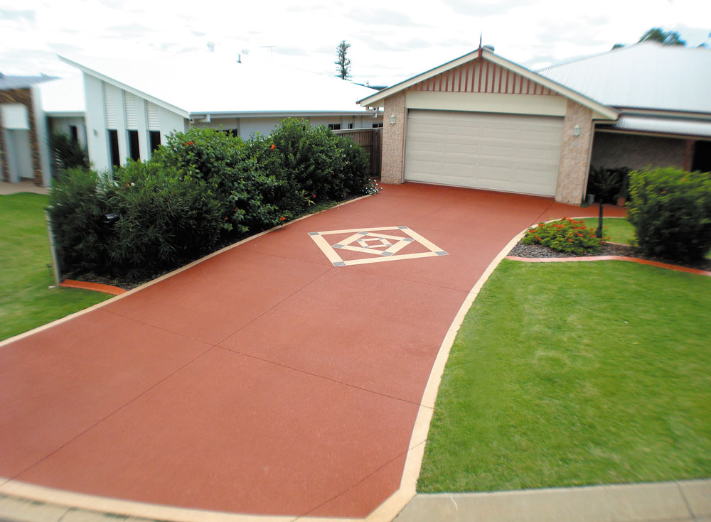 Updated driveway with custom design in the middle